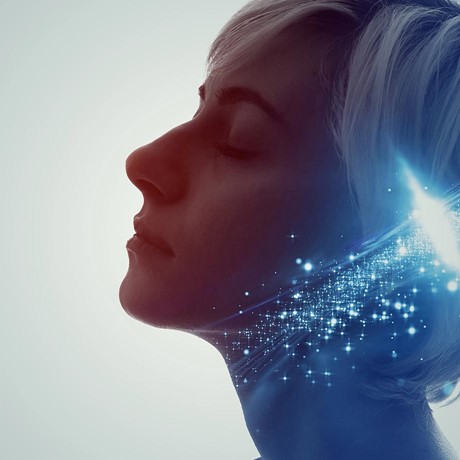 the face of a woman with short hair, closed eyes and blue light-small